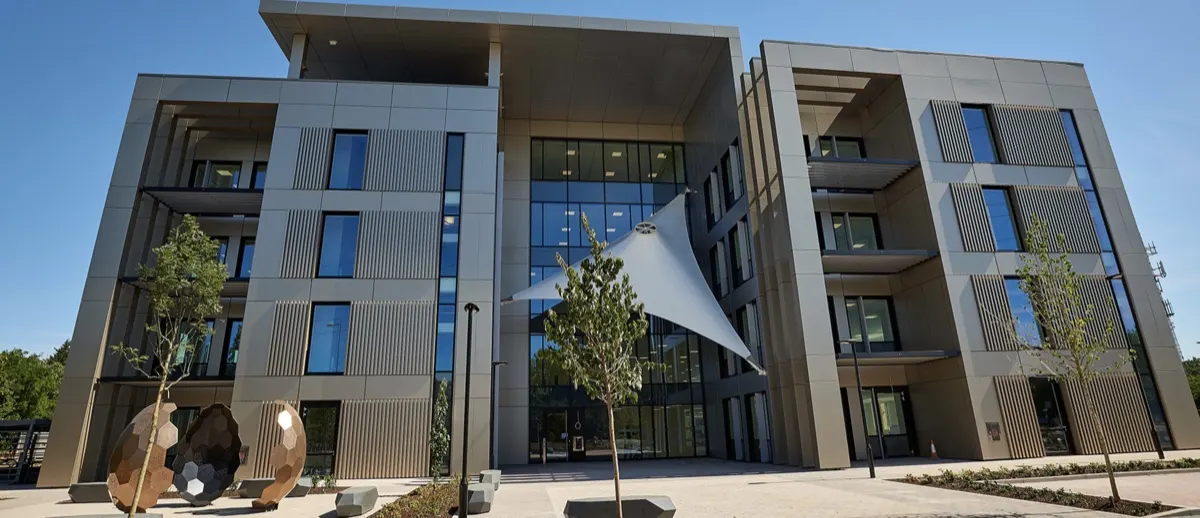 The Maurice Wilkes Building with its glass facade and angular upper floors